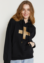 Load image into Gallery viewer, Stella &amp; Gemma Black with Gold Glitter Cross Hoody | Abbey Road Kaikoura
